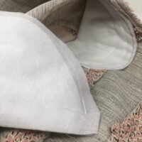 A close up of the corner of a pillow