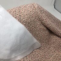 A close up of the pillow on a bed