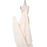 A dress is draped in white fabric.
