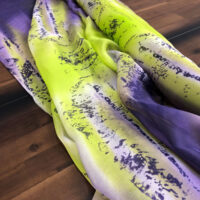 A close up of the purple and yellow scarf