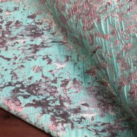 A close up of the fabric on a bed
