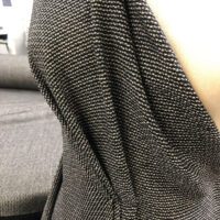 A close up of the fabric on a chair.